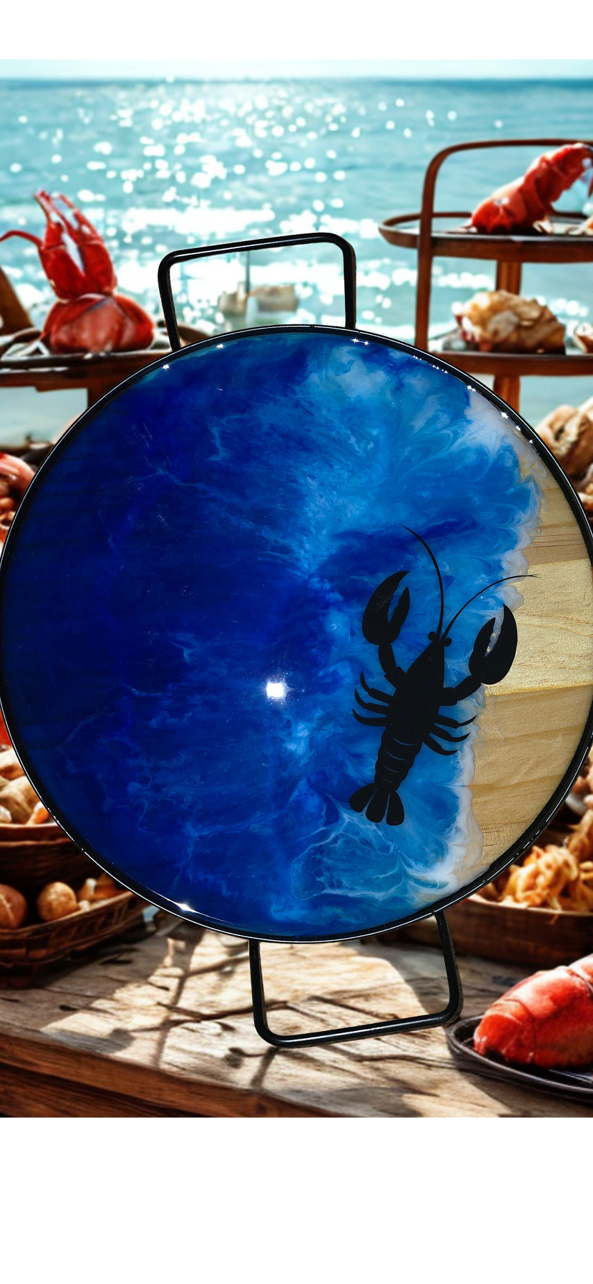 Blue decorative plate with a lobster design on a stand, set against a background of seafood and ocean view.